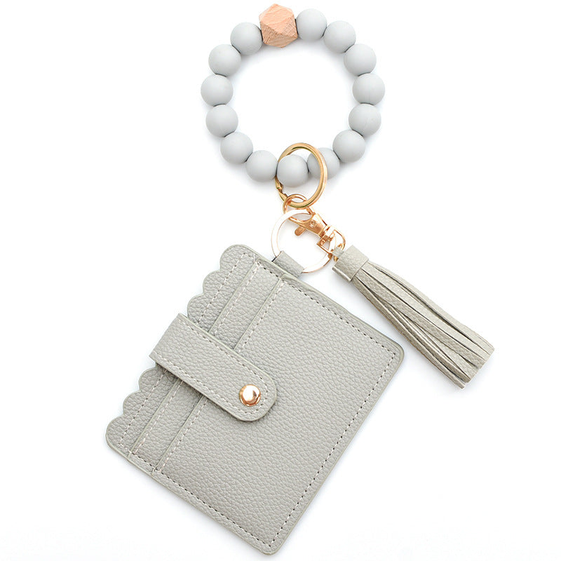 Porte-cartes avec bracelet porte-clés à perles et pompon