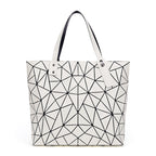 SAC À MAIN À CARREAUX GEOMETRIQUE PLIÉ