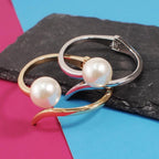 BRACELET IN METAL AND PEARLS WITH GEOMETRIC CUFF 