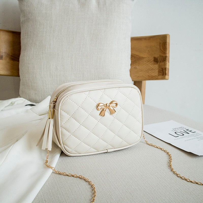 SMALL MESSENGER BAG WITH TASSELS
