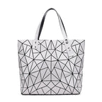 SAC À MAIN À CARREAUX GEOMETRIQUE PLIÉ