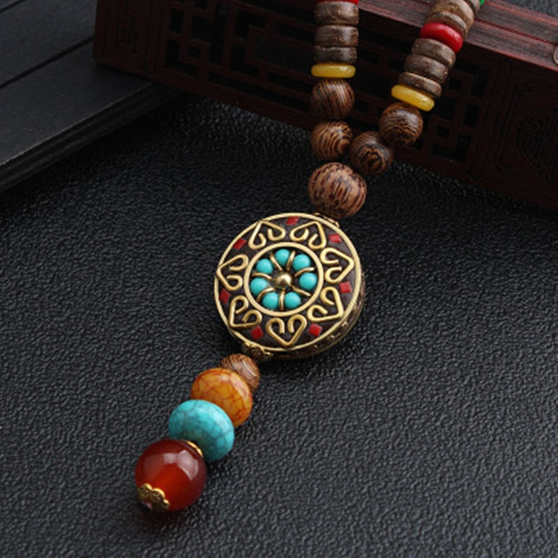 LONG PENDENTIF ET COLLIER PERLÉS EN BOIS DE MALA