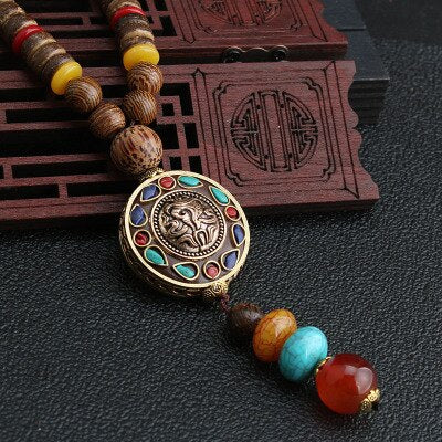 LONG PENDENTIF ET COLLIER PERLÉS EN BOIS DE MALA